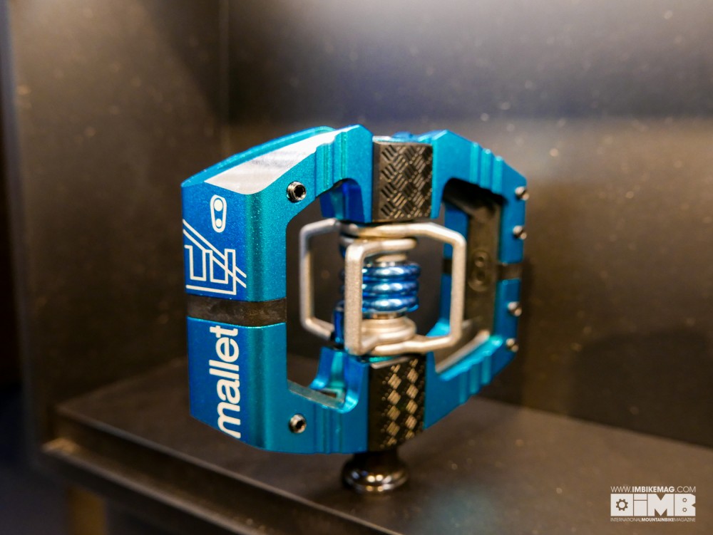 Close up of the new Mallet E with the swappable traction pads to tune your grip and chamfered corners to glide off rock strikes...