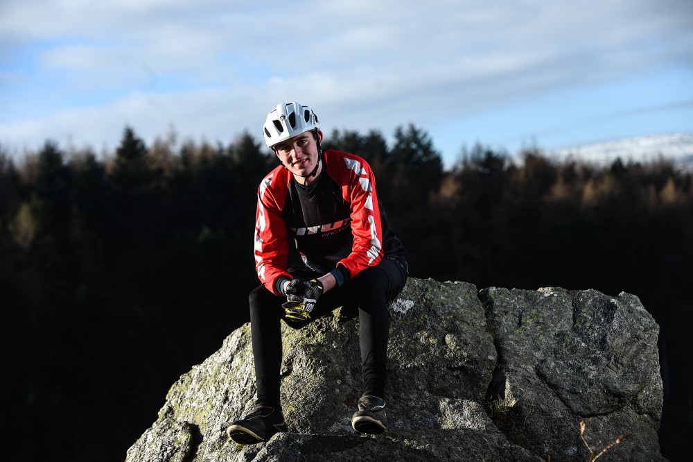 Killian Callaghan on a rock by Ramsey Cardy