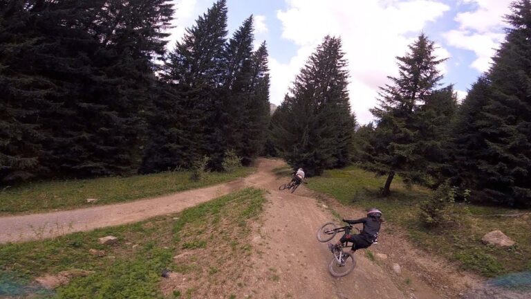 Chasing Downhill Mountain Bikers with a Drone Racer